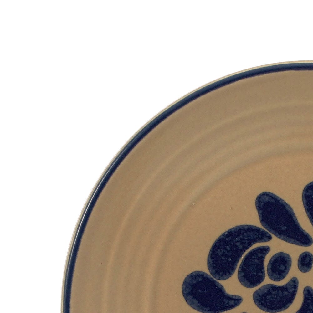 Close-up of the soup bowl and mug from the tableware set, showing the glazed finish
