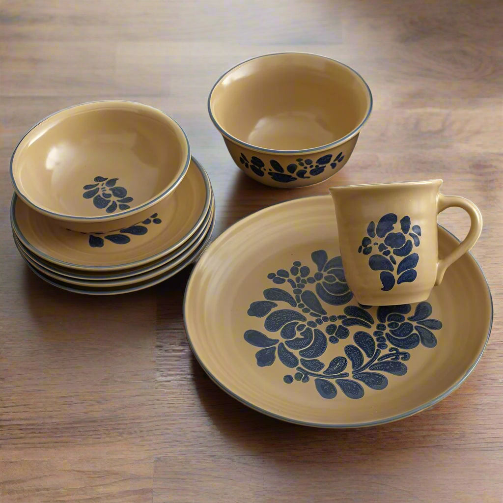Side angle of the full dinnerware set in use during a casual family meal