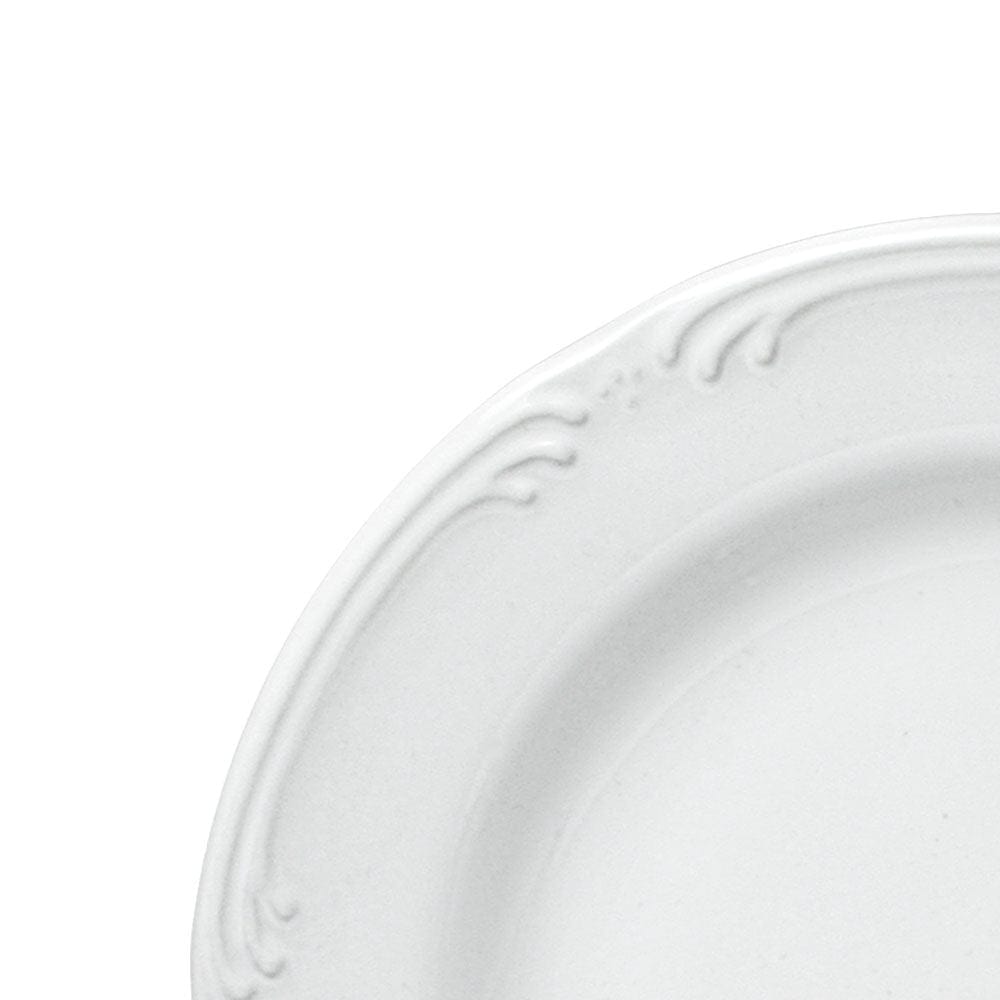 Close-up of a stoneware salad plate with a fresh garden salad.