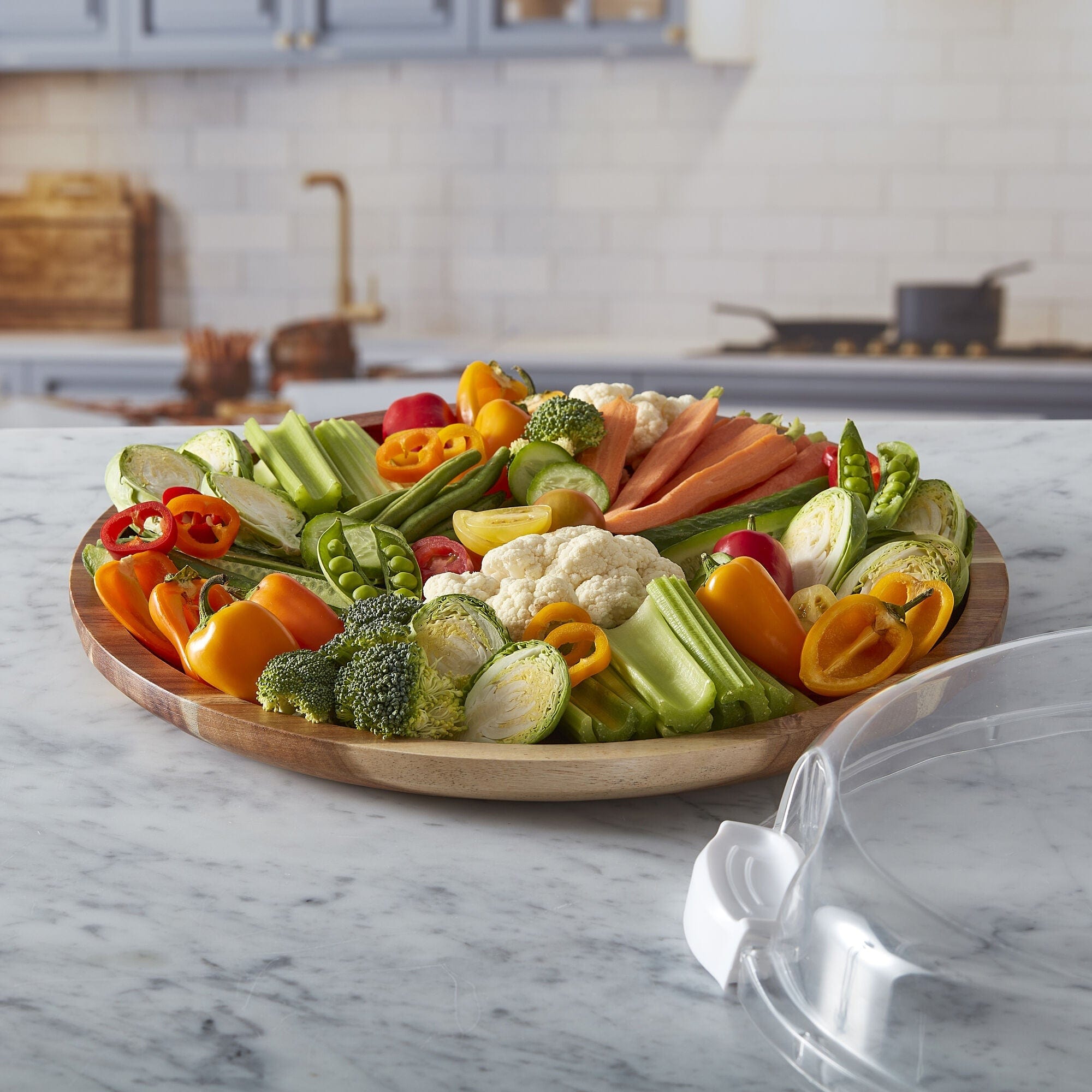 Versatile Culinary Board with clear lid showing arranged cheeses and fruits