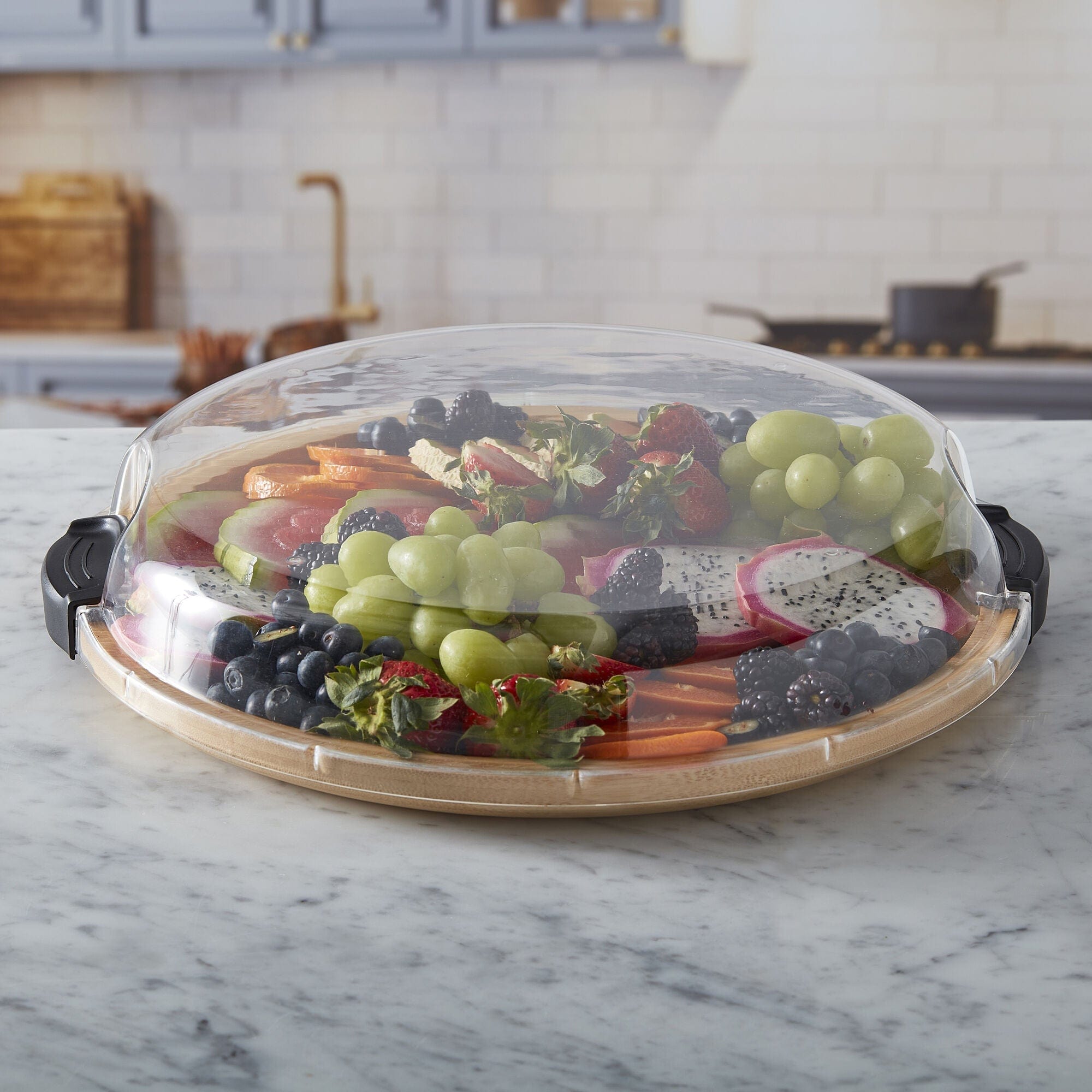 Versatile Culinary Board with clear lid showing arranged cheeses and fruits