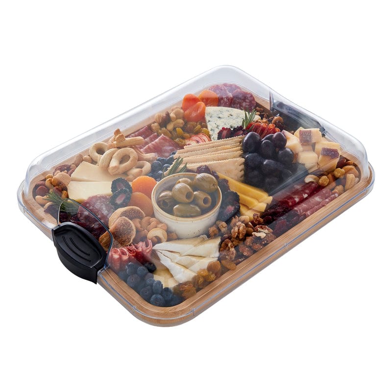 Portable food presentation board with lid during outdoor picnic setting