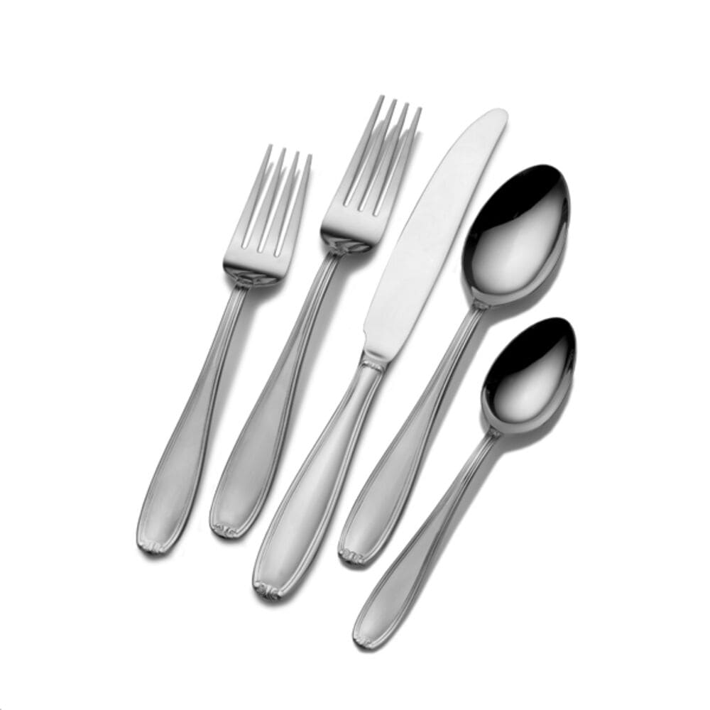 Close-up of 20-piece stainless steel flatware set arranged on a dining table, highlighting sleek design and quality craftsmanship