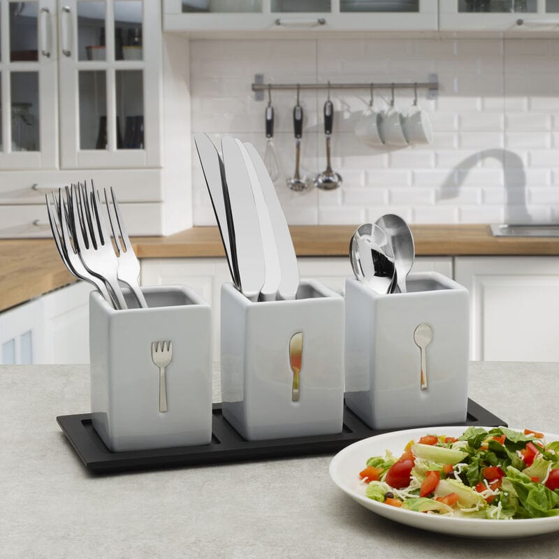 Ceramic flatware caddy set on wooden tray for organized dining