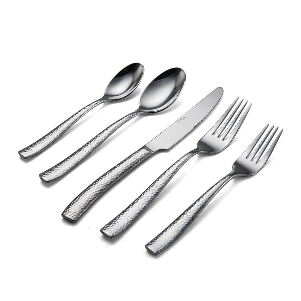 Elegant textured silverware arranged for a dinner party setting