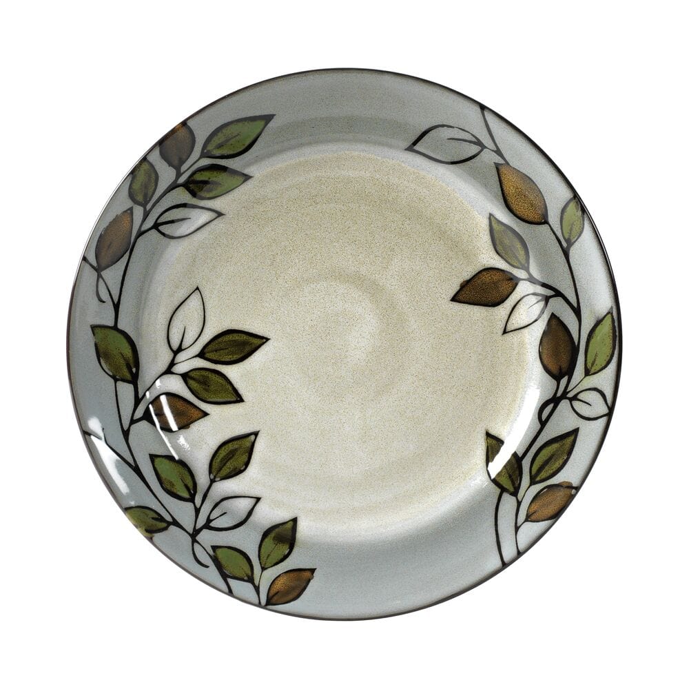 Close-up of rustic leaf patterned dinner plates showing reactive glaze finish