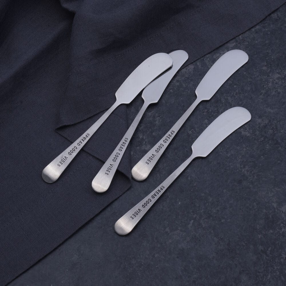 Vibrant Vibes cheese spreaders alongside a selection of dips and butter.