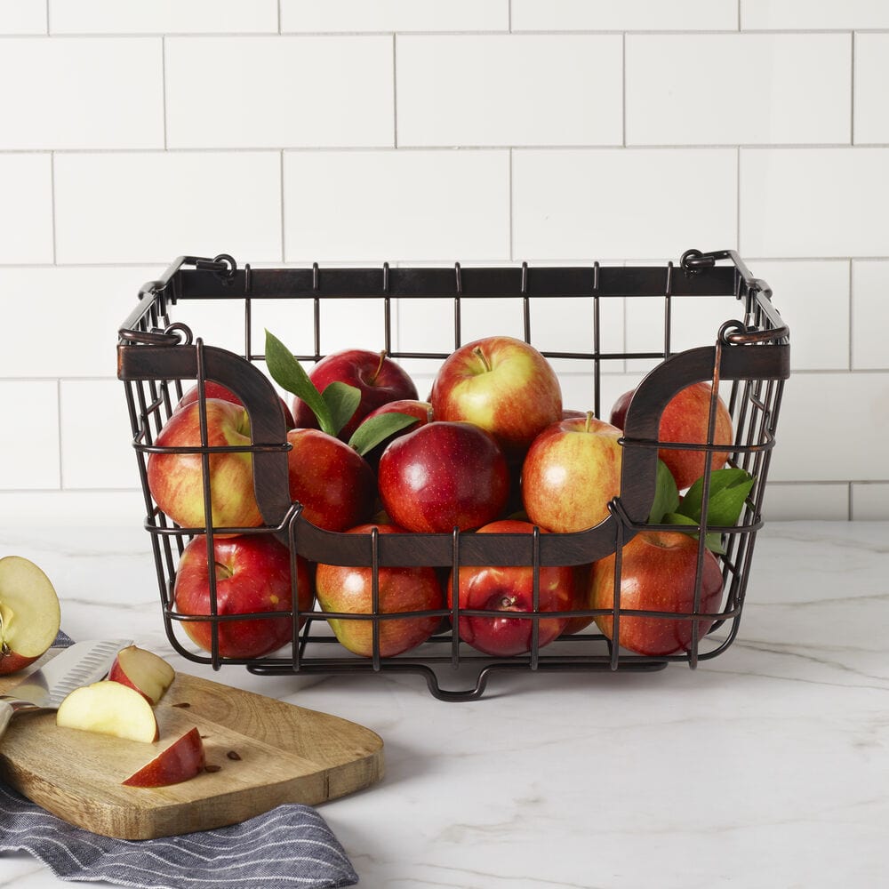 Close-up of black stackable storage basket showing iron finish