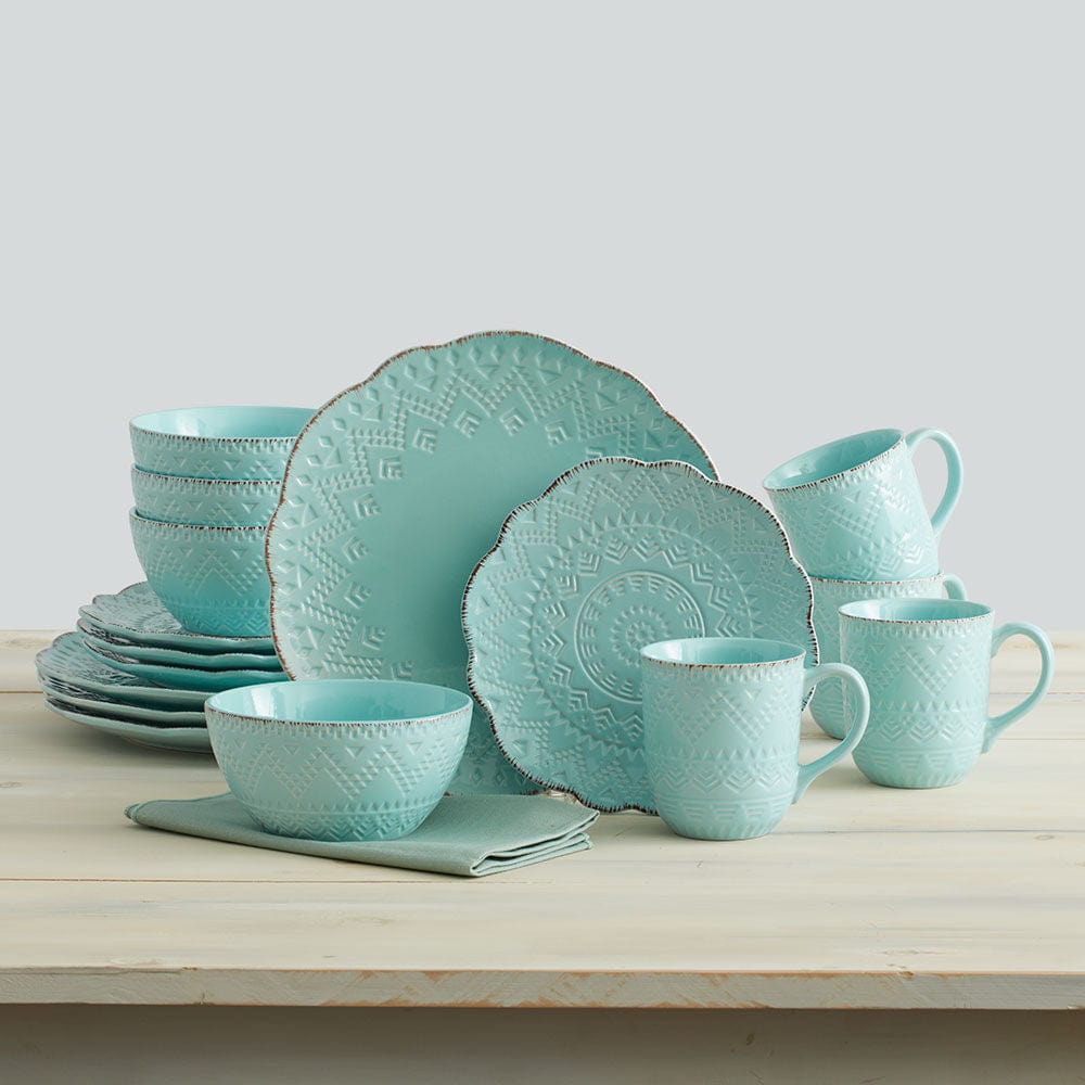 Top view of a full place setting featuring the Remembrance teal stoneware dinnerware set.