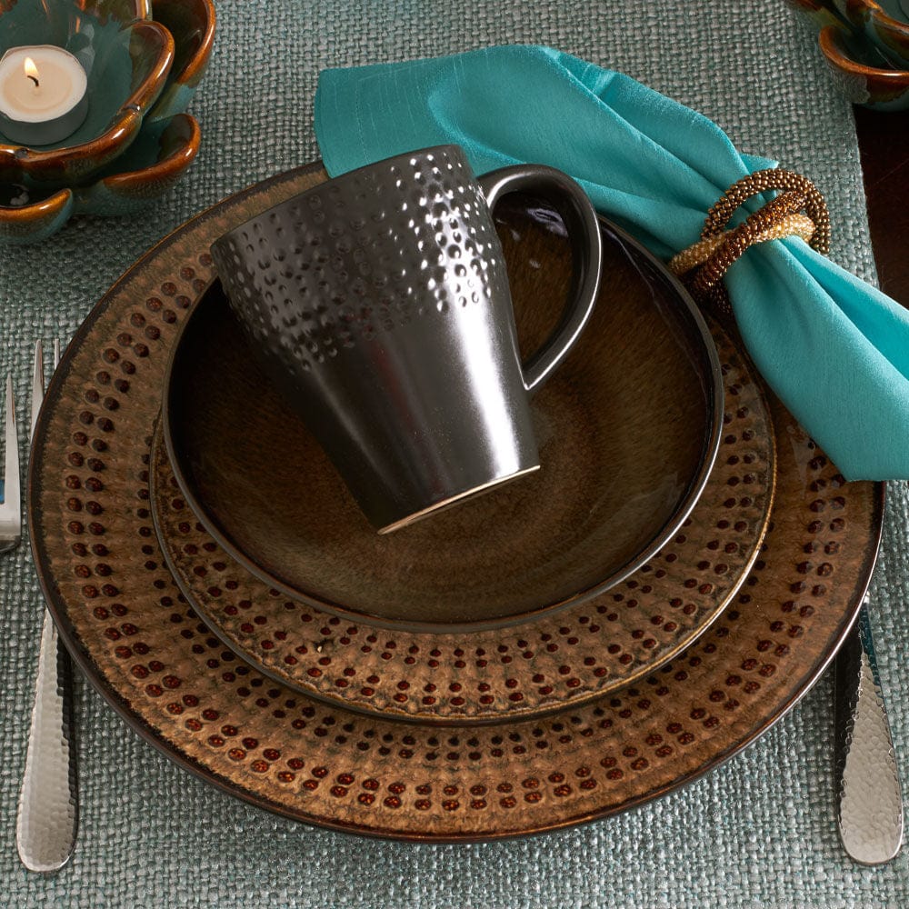 Unique reactive glaze dinnerware set displayed elegantly on a dining table, showcasing its vibrant colors and unique designs.