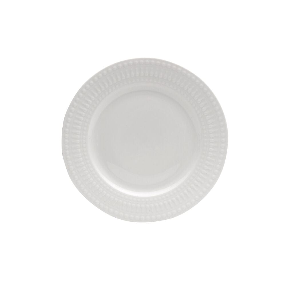 Elegant porcelain dinnerware set displayed on a dining table, showcasing its sophisticated design.