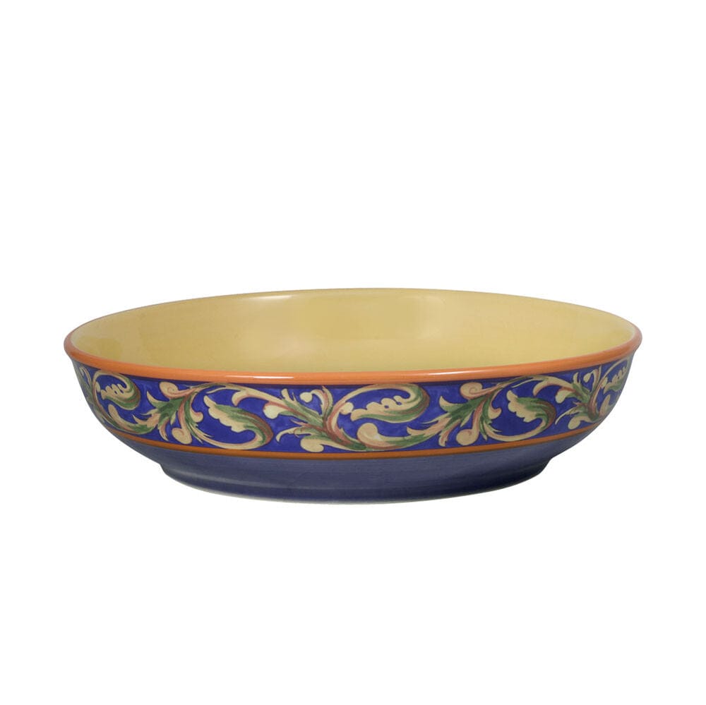 Lifestyle photo featuring individual serving bowls with mixed greens and vinaigrette on a farmhouse table