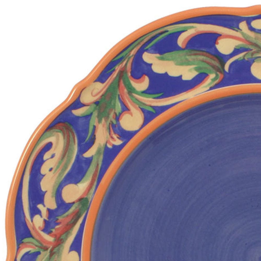 Plate in use at a dinner table setting, displaying a delicious main course served on the dishwasher safe scalloped plate.
