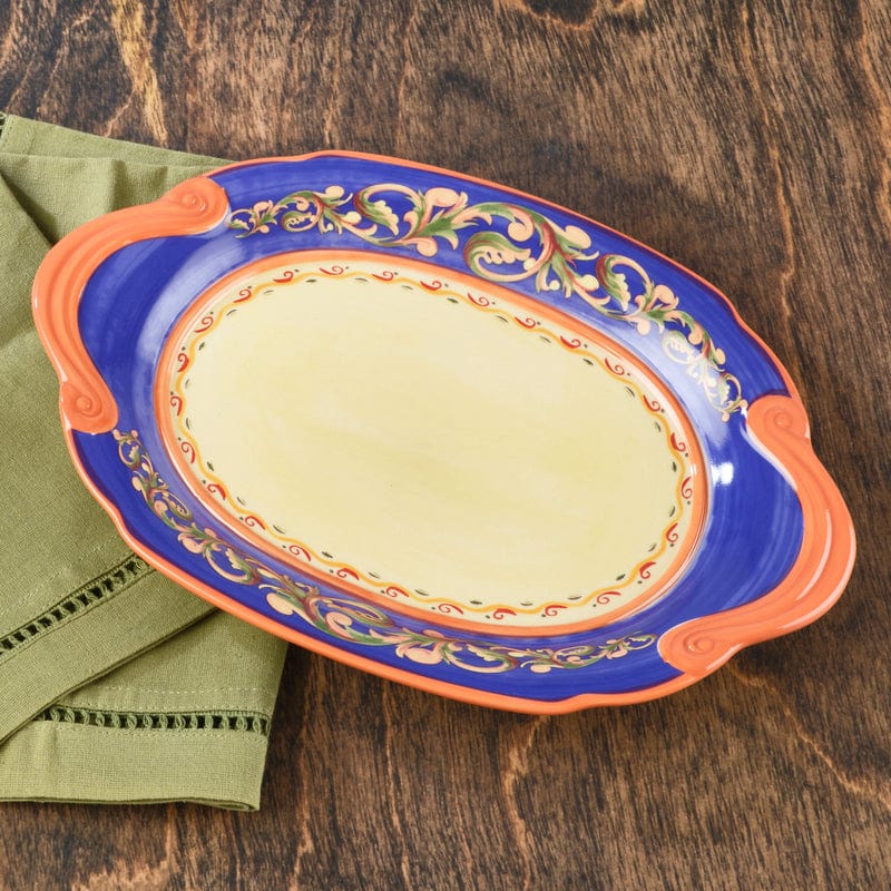 Close-up of the embossed handle serving plate showing blue rim and stoneware texture