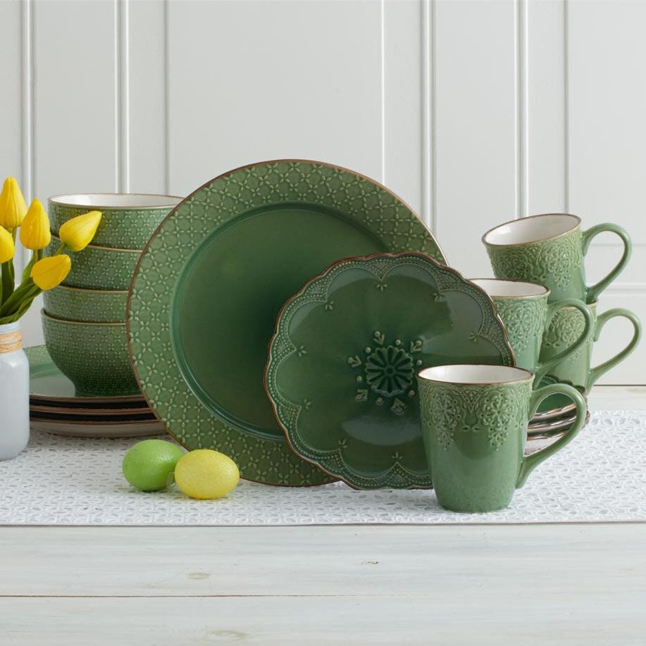 Elegant French Lace Green Stoneware Dinnerware Set displayed on a dining table, showcasing its elegant design and color.