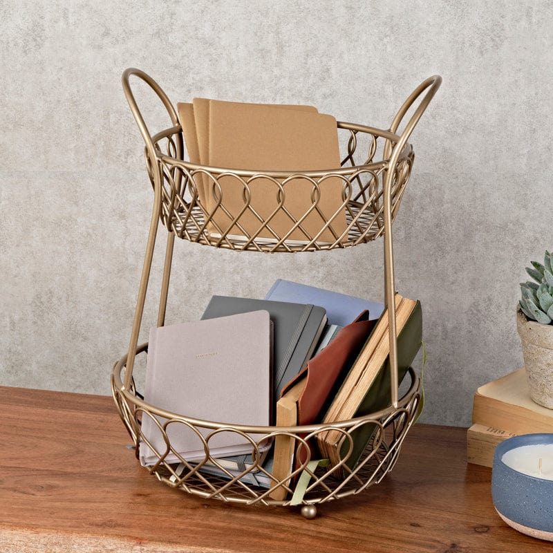 Front view of affordable wrought iron countertop basket styled with fruits and mugs