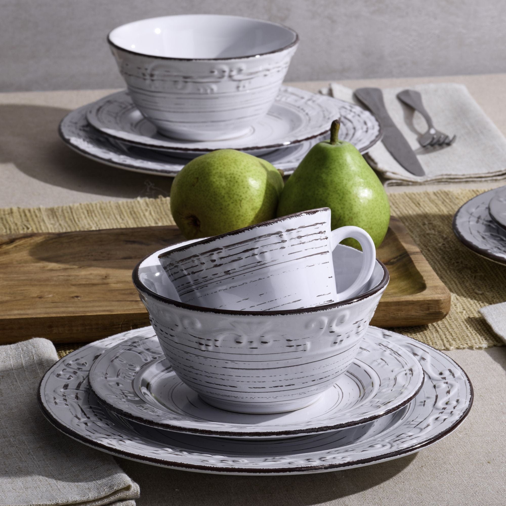 Dinnerware set for 4 arranged on a modern dining table, highlighting durability and style