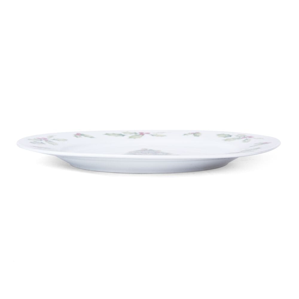 Elegant Christmas dinner plates set showcasing a festive table setting with holiday decorations.