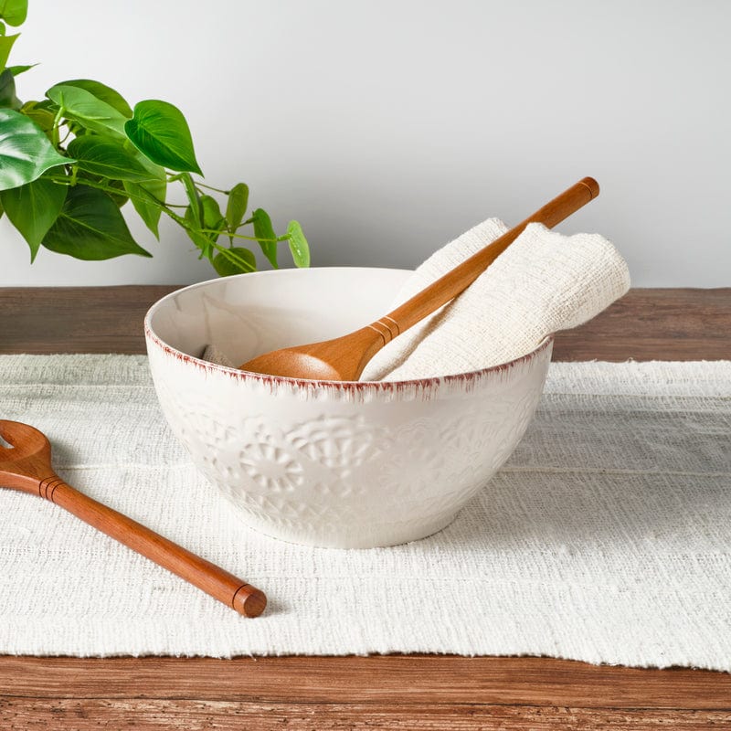 Chateau stoneware serving bowl filled with fresh salad on a festive dining table.