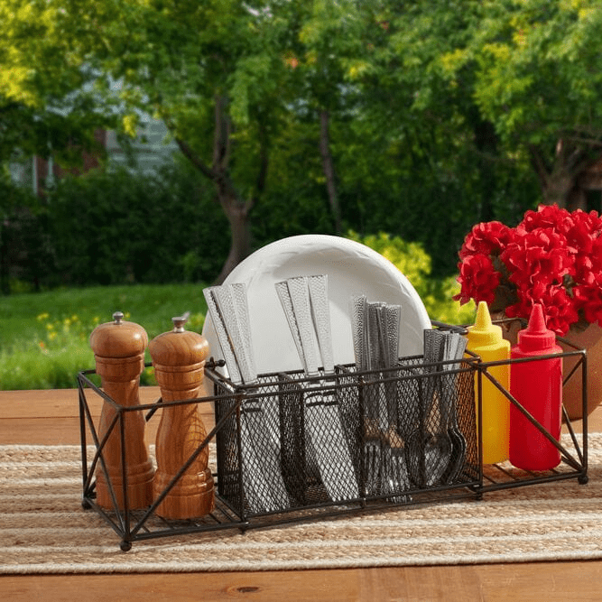 Elegant Outdoor Buffet Caddy showcasing its four sections for organization at a picnic.