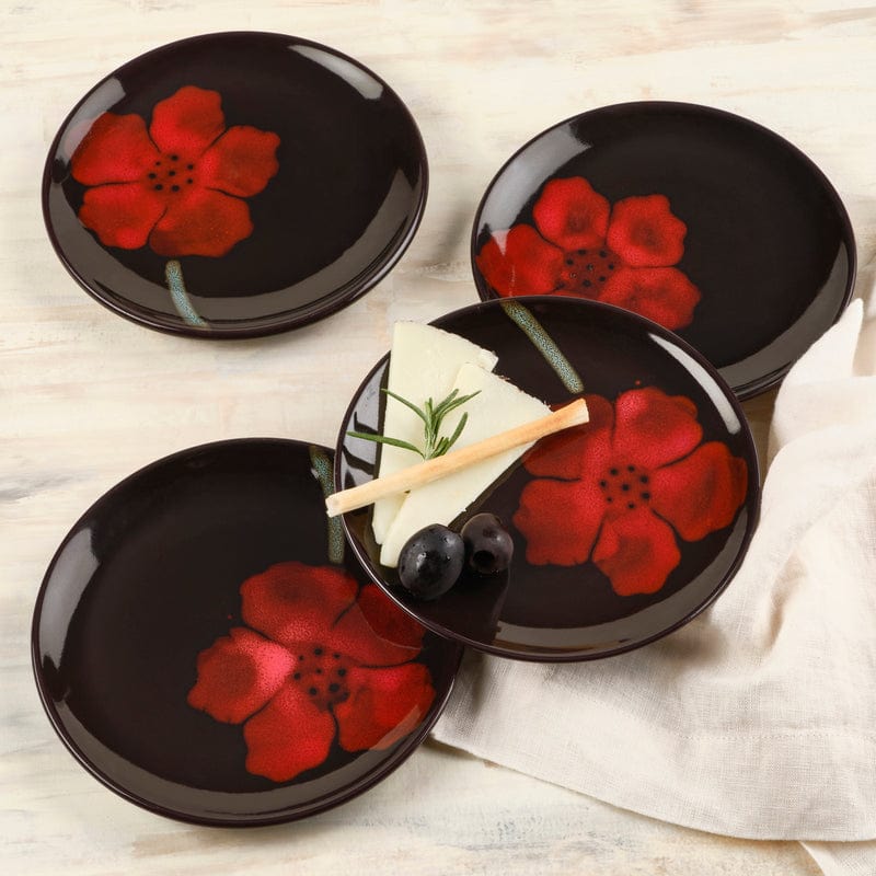 Set of four unique decorative plates for serving appetizers, showcasing a vibrant reactive glaze.