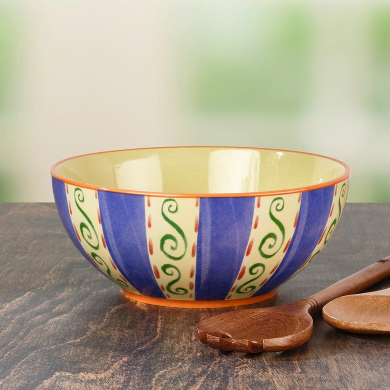 Luna's stoneware vegetable serving bowl filled with fresh salad on a dining table.