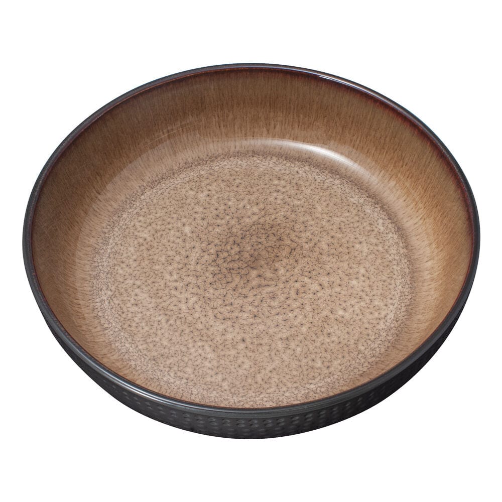 Cambria stoneware bowl on a dining table, ready for family dinner.