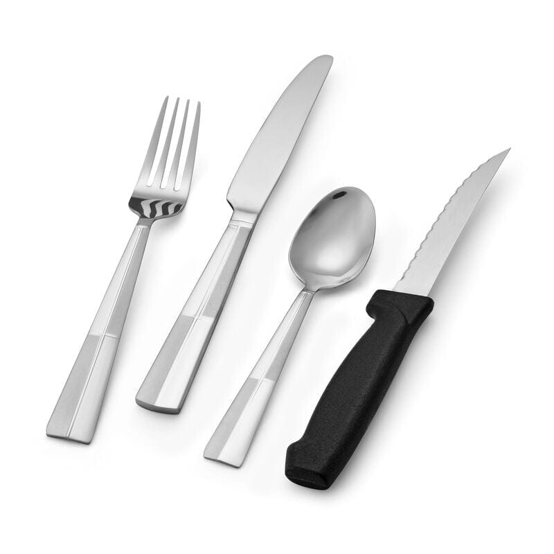 Arabesque flatware set arranged on a formal dining table for luxury silverware presentation