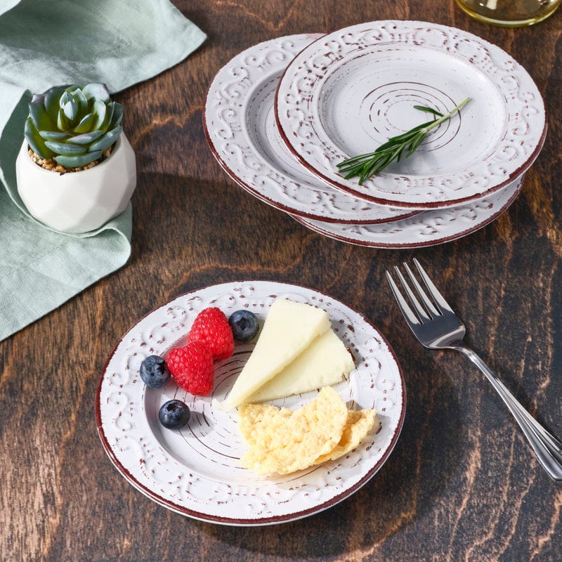 Trellis White appetizer plates set of 4 showcasing the embossed design and elegant scroll pattern.