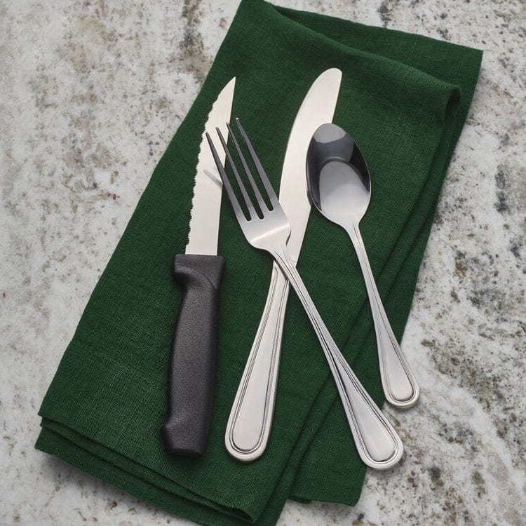 Rockport flatware set arranged for a formal dinner setting, emphasizing its versatility.