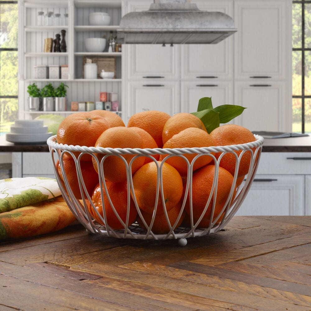 White wrought iron bread and fruit basket in modern kitchen setting