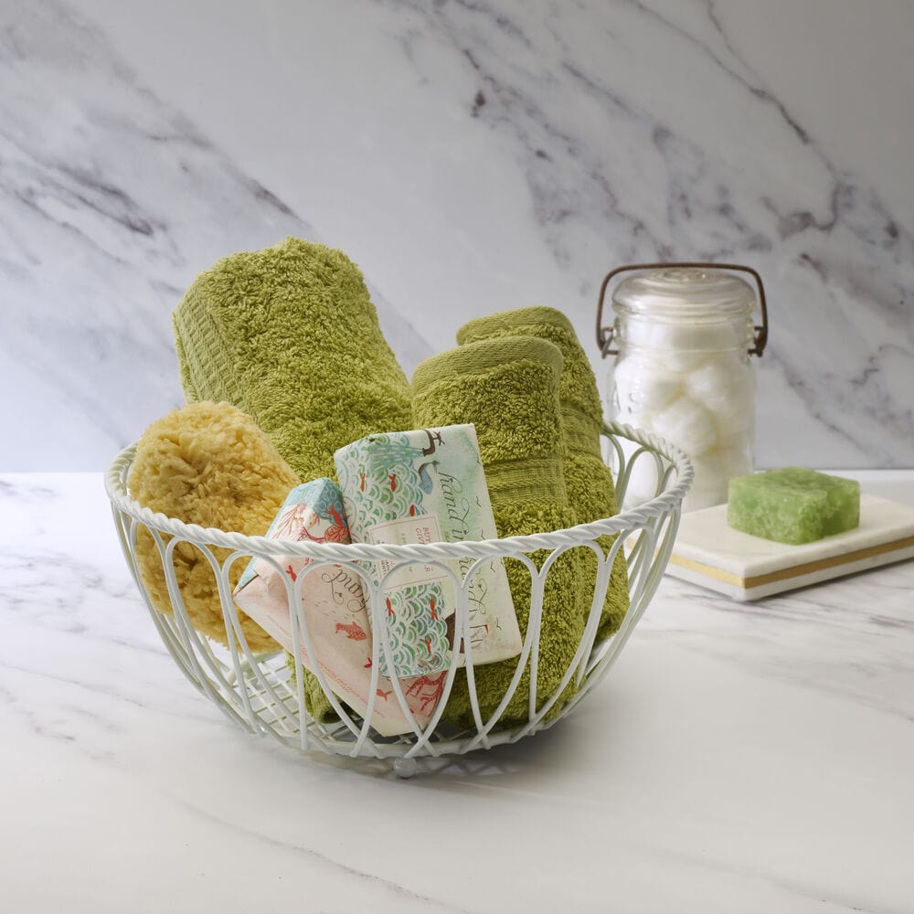 Large white iron fruit basket for sale on kitchen counter
