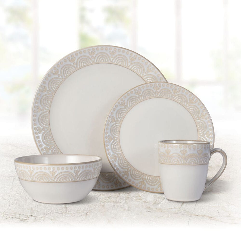 Top-down view of the Pfaltzgraff Amelia dinnerware set arranged for four on a wood table