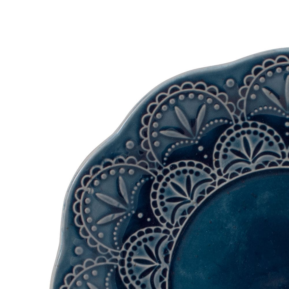 Close-up view of Havana blue stoneware dinner plate with embossed design