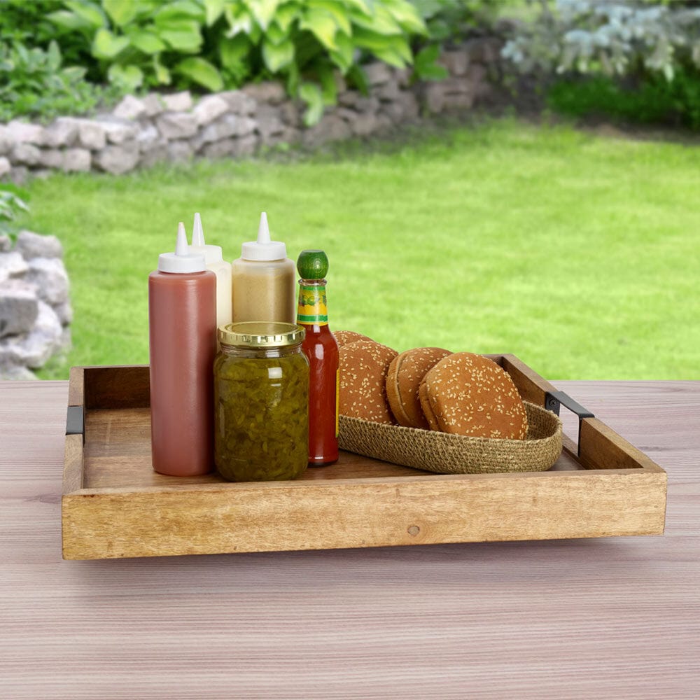 Large wooden Lazy Susan for parties with a square design and iron handles on a dining table