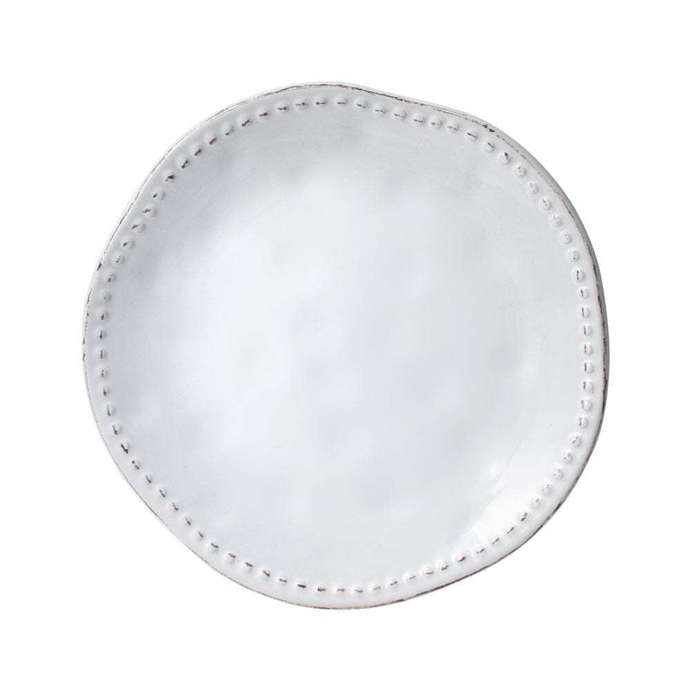 Close-up of Canyon Bead stoneware salad plates in a dishwasher, highlighting their microwave safe feature.