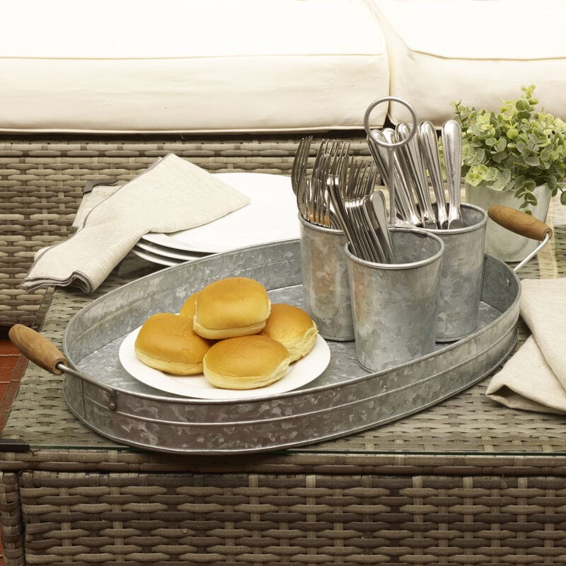 Galvanized oval serving tray with wooden handles, close-up view
