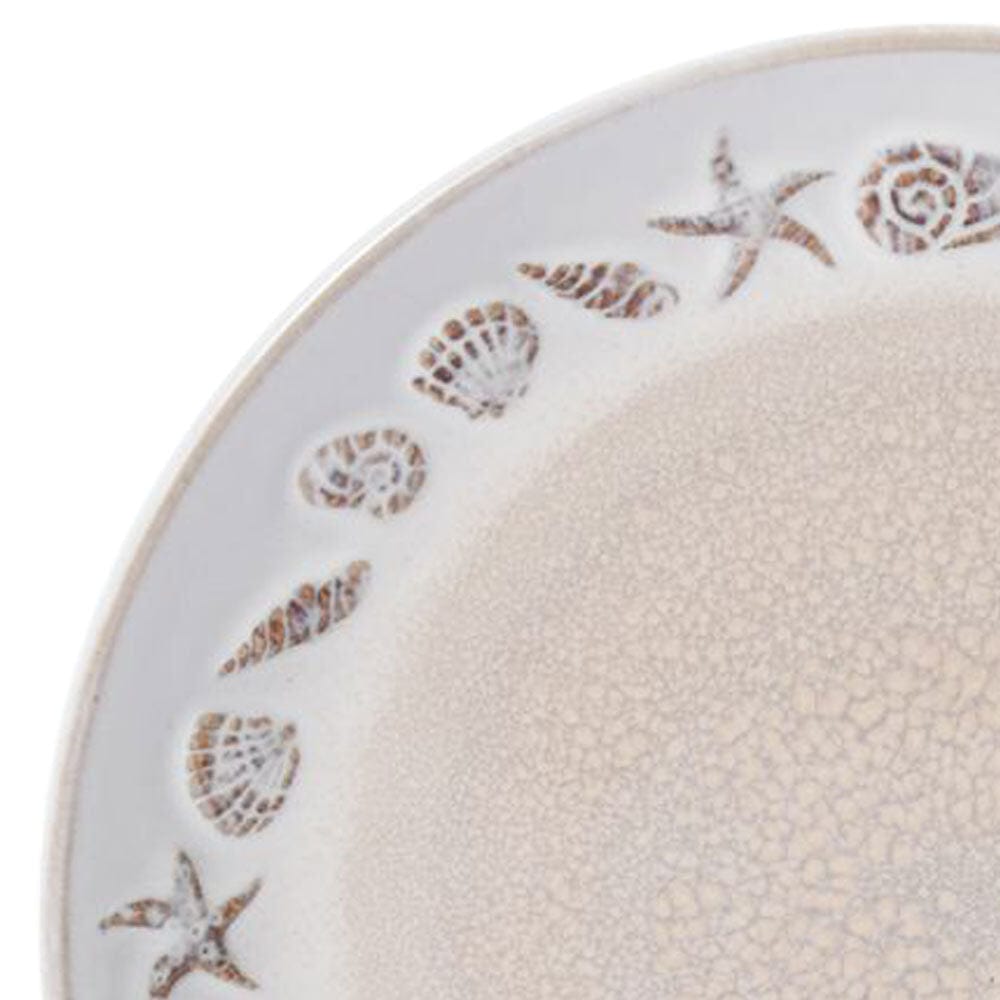 Top-down view of reactive glaze dinnerware set with mugs arranged on a wooden dining table