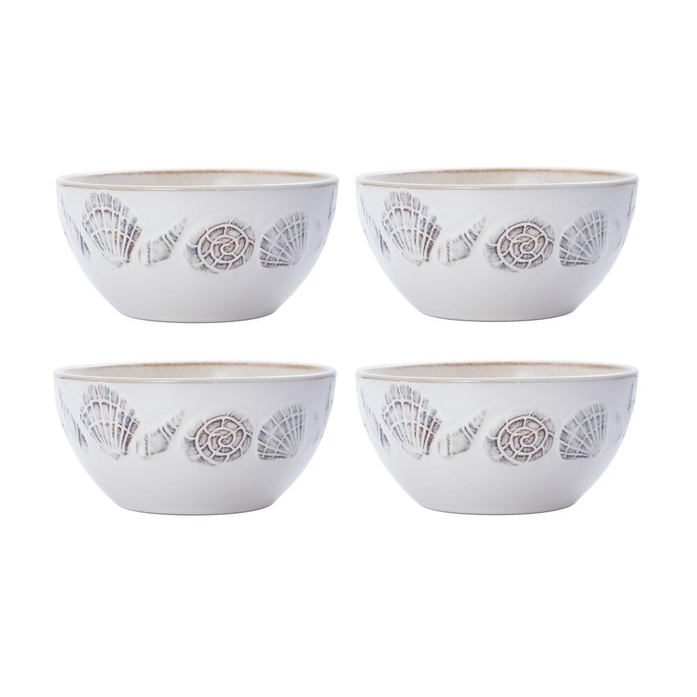 Top-down view of reactive glaze dinnerware set with mugs arranged on a wooden dining table