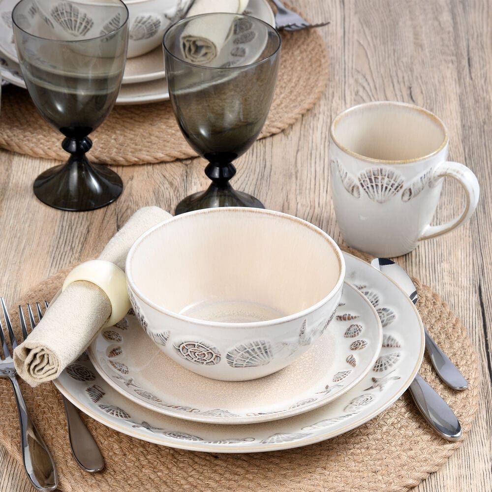 Close-up of one soup bowl and mug from the 16 piece dinnerware set, highlighting unique glaze patterns