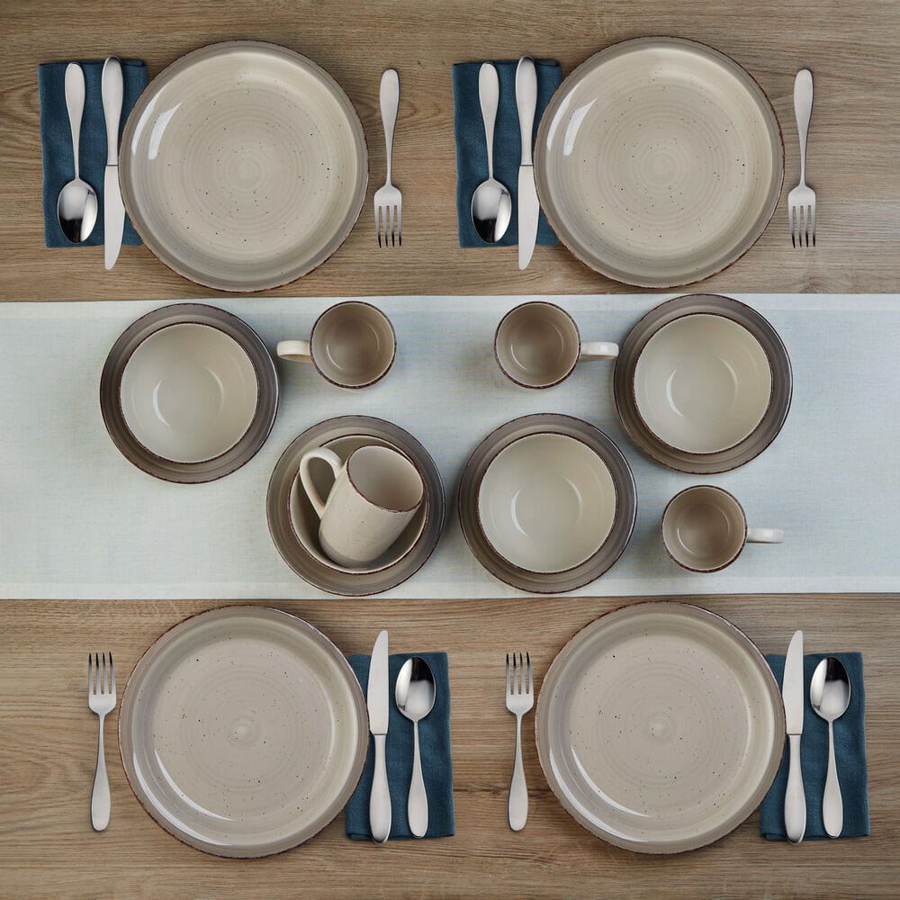 Close-up of Sadie cream dinner plates with a modern, organic shape