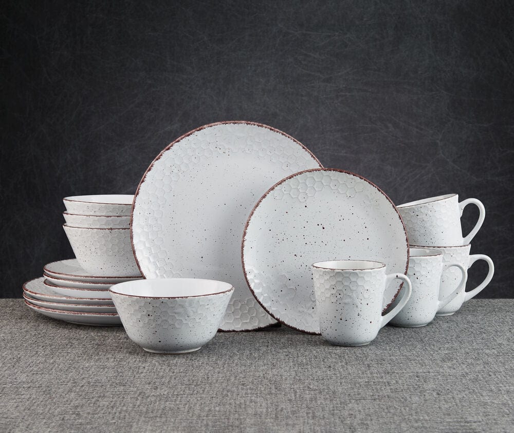 Close-up of reactive glaze dinnerware set showing the unique color variations