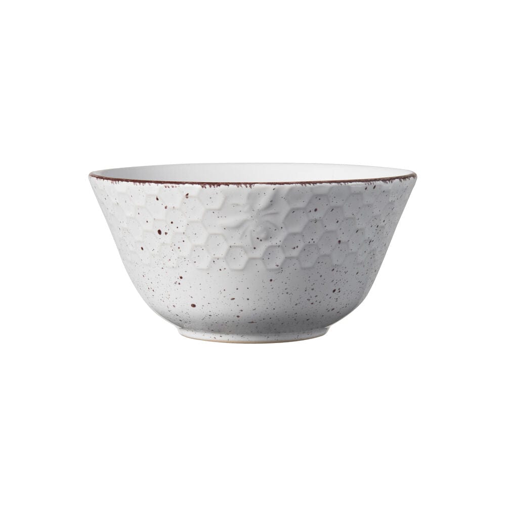 Set of stoneware dishes including dinner plates, bowls, and mugs arranged for a meal