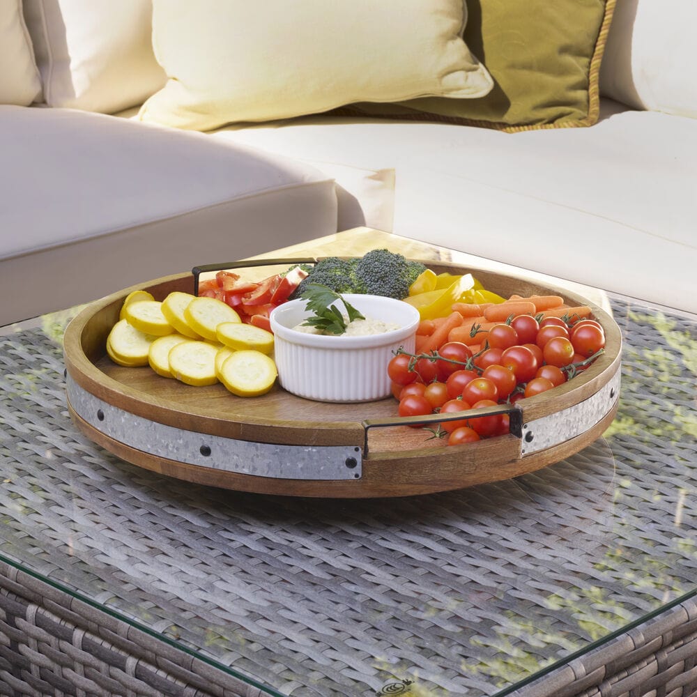 Elegant dining setup featuring a large galvanized lazy Susan with dividers