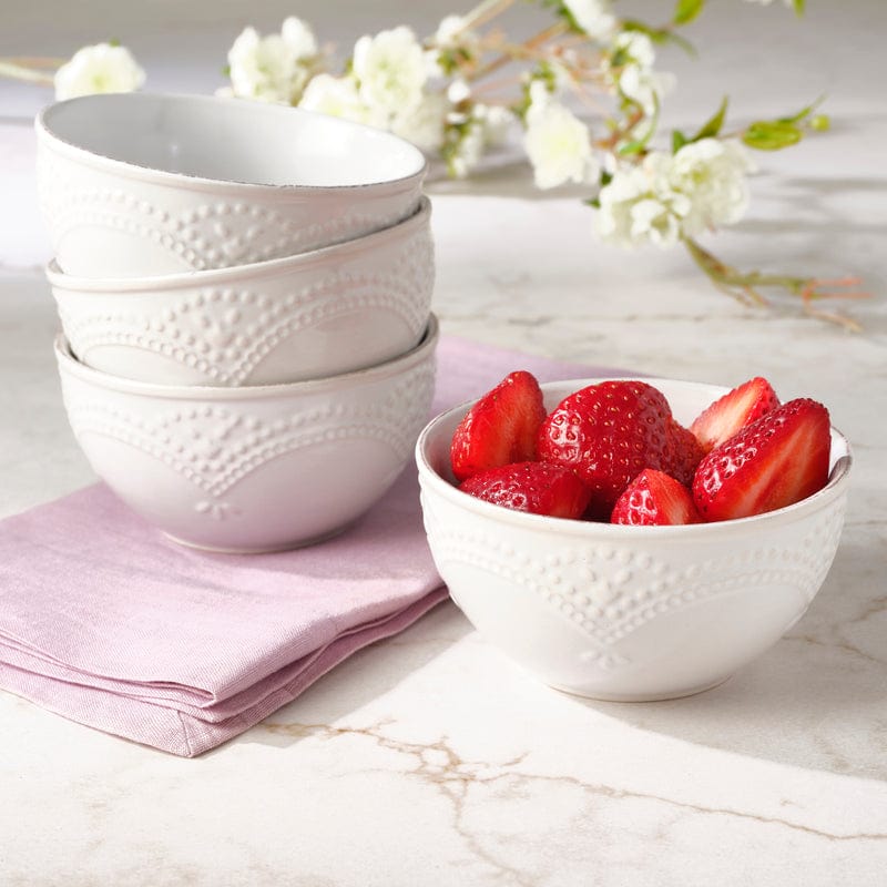 Elegant vintage lace fruit bowl set displayed on a dining table.