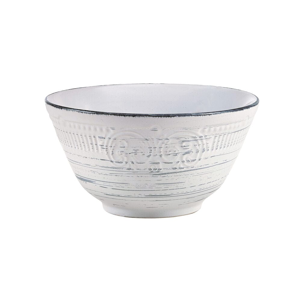 Rustic Charm dinnerware set arranged for a festive gathering, featuring plates, bowls, and mugs.