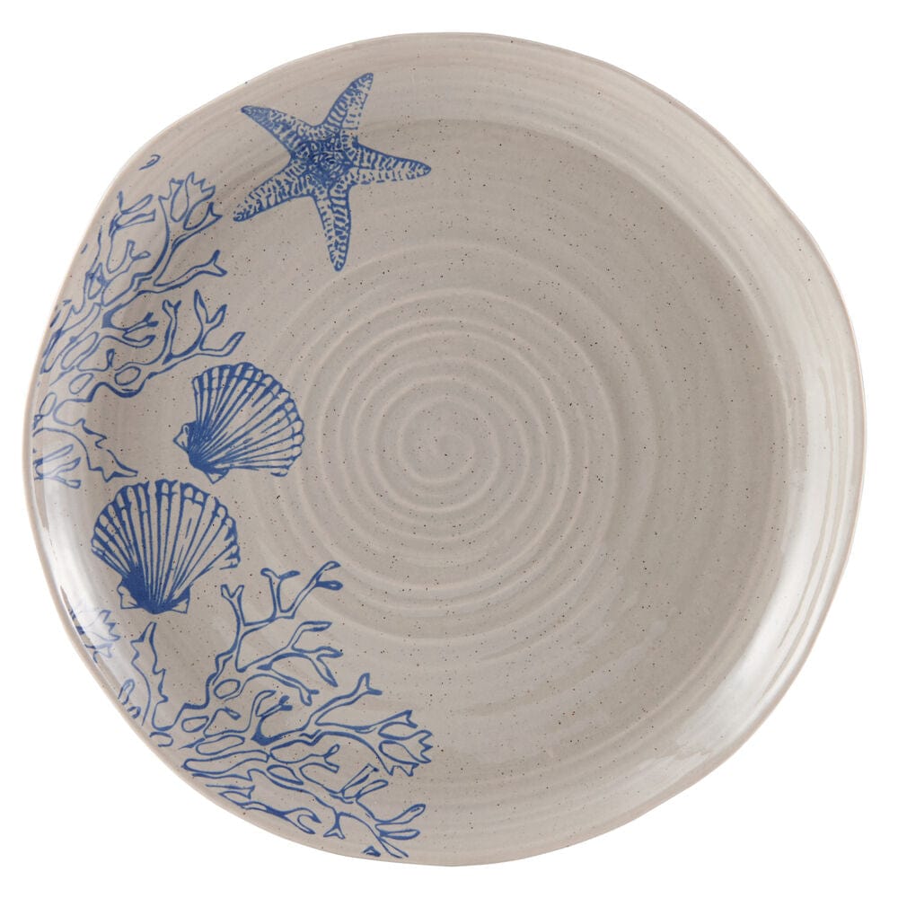 Set of 4 mugs and plates from the rustic dinnerware set with ocean-inspired pattern, arranged on a wooden table