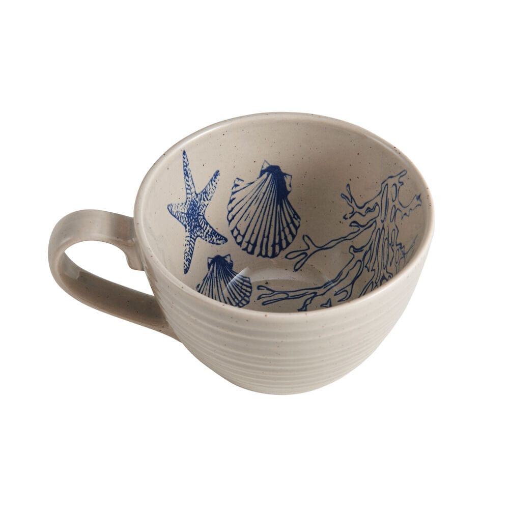 Set of 4 mugs and plates from the rustic dinnerware set with ocean-inspired pattern, arranged on a wooden table