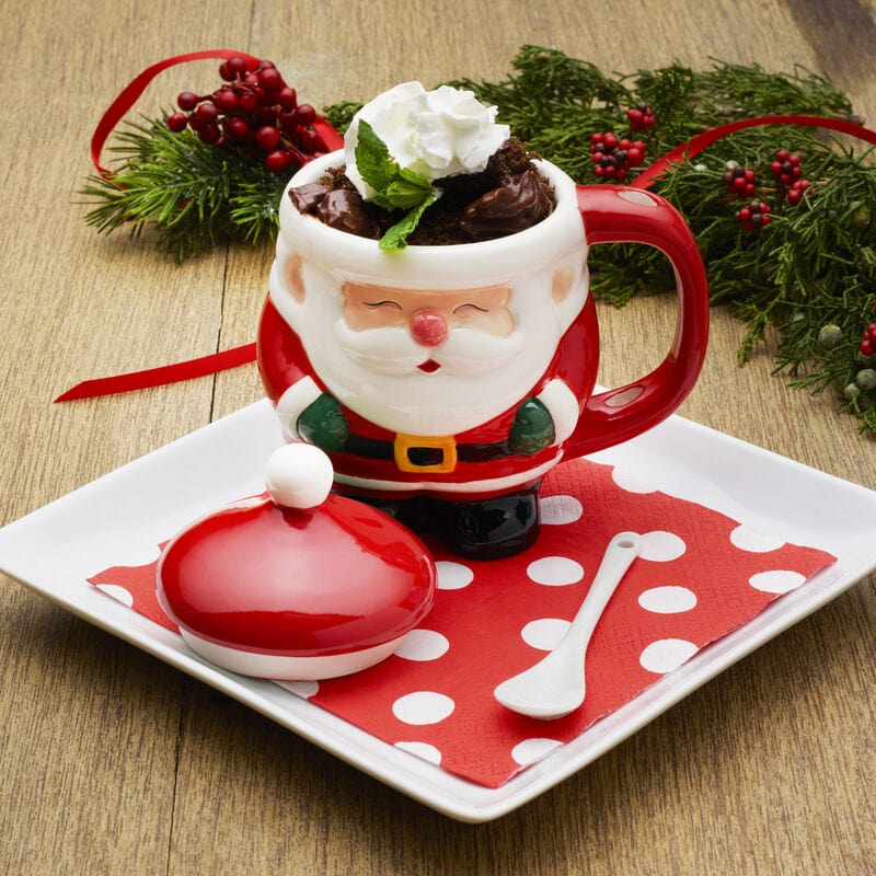Close-up of Santa mug with spoon and lid, perfect for holiday hot chocolate