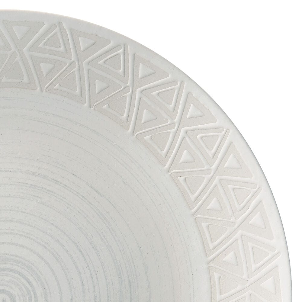 Vera dinnerware set for 4, showing dinner plates and mugs on a modern table